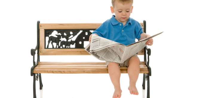 cute-little-boy-reading-newspaper-wallpaper-660x330